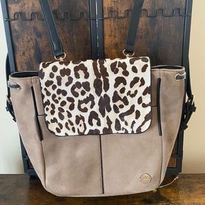 Tan backpack with animal print detail